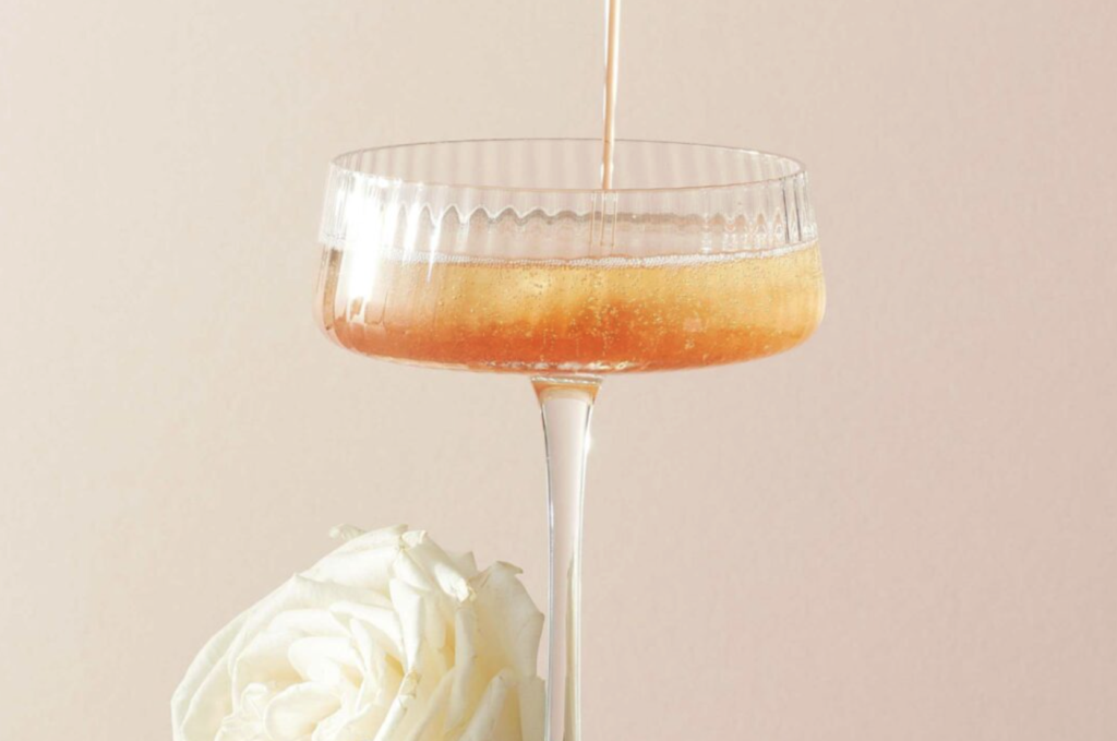 tea infused kir drink with black tea and rose - tea royale
